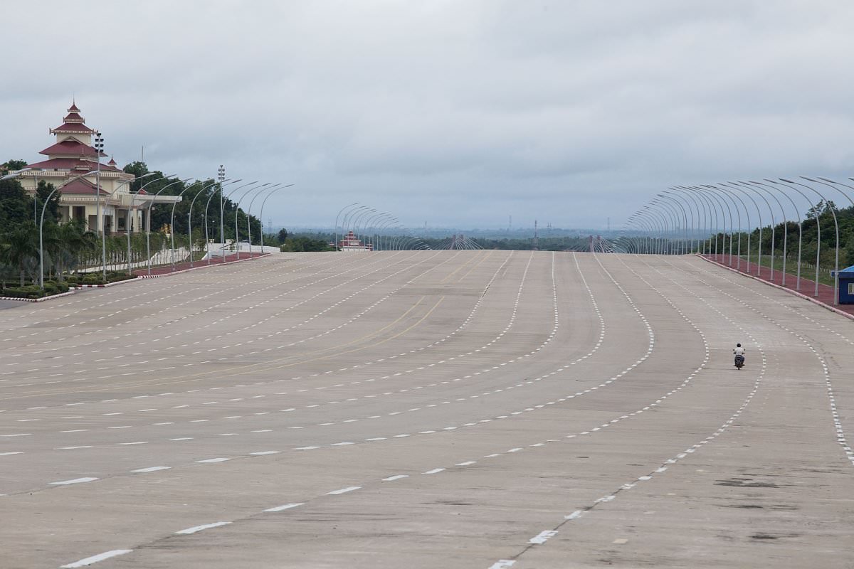 image rush hour is nonexistent in naypyidaw here a solo motorcyclist drives down a 20 lane highway