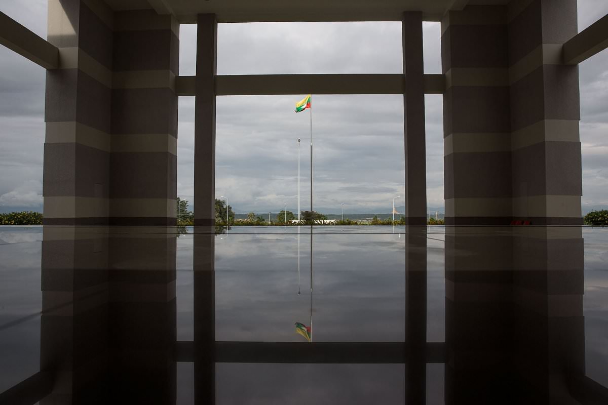 image still the burmese flag flies proudly outside the citys national museum which of course is completely free of people