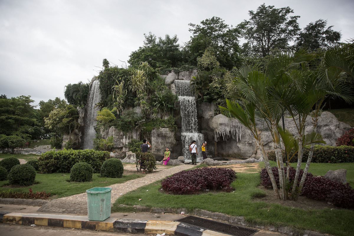 image the busiest it appears to get is shown below where friends take photos in front of artificial waterfalls at the naypyidaw water fountain garden