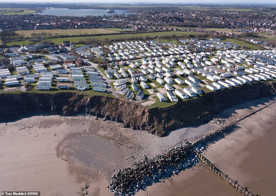 image 10974014 6808159 Drone footage shows the homes perching perilously on the edge of a 38 1552567614596