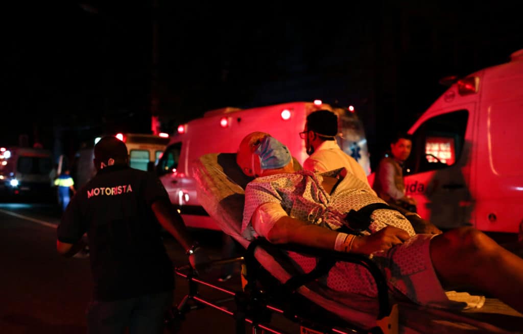 A patient is evacuated after a fire hit the Badim Hospital in Rio de Janeiro, Brazil September 12, 2019. REUTERS/Ian Cheibub  NO RESALES. NO ARCHIVES