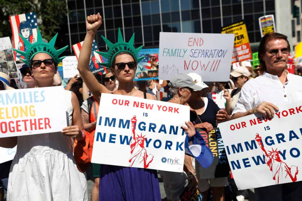 Demonstrators participate in "Keep Families Together" march to protest Trump administration's immigration policy in Manhattan, New York, U.S., June 30, 2018.  REUTERS/Shannon Stapleton - RC161CDE46D0