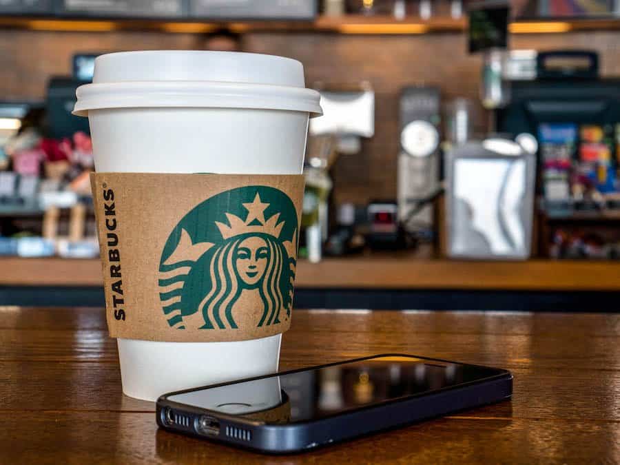 WEIFANG, SHANDONG PROVINCE, CHINA - 2016/08/31: Coffee cup on table in a Starbucks shop.  During the third quarter 2016, Starbucks China had $768.2 million in sales, a growth of 17% compared to the prior period. (Photo by Zhang Peng/LightRocket via Getty Images)