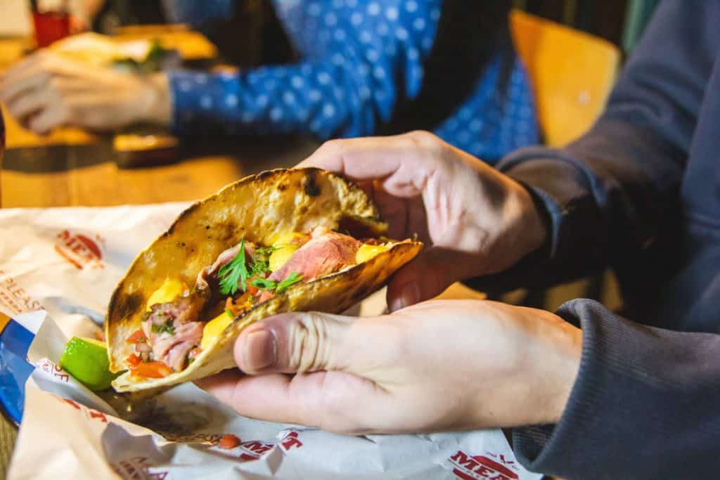 image typical dishes of Valencia person showing taco with parsley on top 2338015