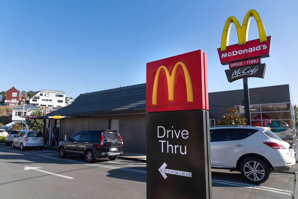 Customers queue up for the "drive-thru" at a McDonald's restaurant on the first day of the easing of restrictions in Wellington on April 28, 2020, following the COVID-19 coronavirus outbreak. - New Zealanders satisfied their cravings for hamburgers and coffee as a five-week lockdown eased on April 28, amid hopes the South Pacific nation has the coronavirus under control. (Photo by Marty MELVILLE / AFP) (Photo by MARTY MELVILLE/AFP via Getty Images)