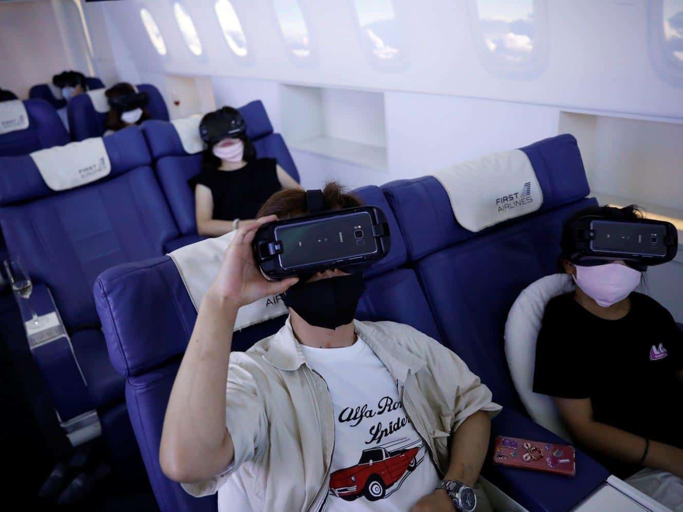 customers-flight-seats-use-virtual-reality-vr-devices-first-airlines-provides-vr-flight-experiences-including-360-degree-tours-cities-and-meals-tokyo-japan-august-12-2020-kim-kyung-hoon-reuters-2040613