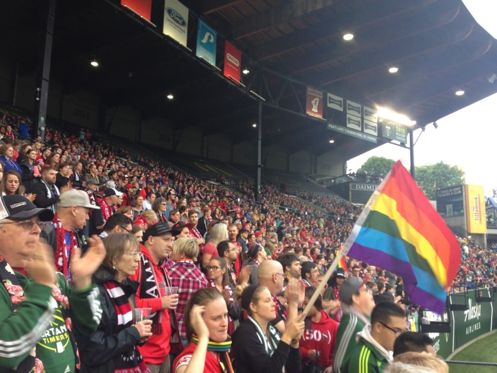 image LGBT rainbow pride flag at professional soccer game