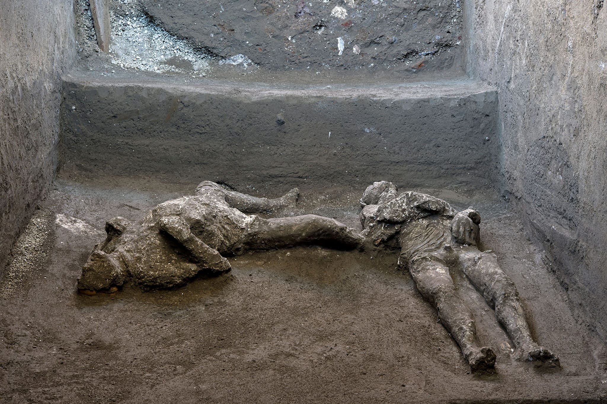 Remains of two men who died in the volcanic eruption that destroyed the ancient Roman city of Pompeii in 79 AD are discovered in a dig carried out during the coronavirus disease (COVID-19) pandemic in Pompeii, Italy November 18, 2020. Picture taken November 18, 2020. Luigi Spina/Handout via REUTERS    REUTERS ATTENTION EDITORS - THIS IMAGE HAS BEEN SUPPLIED BY A THIRD PARTY.     TPX IMAGES OF THE DAY