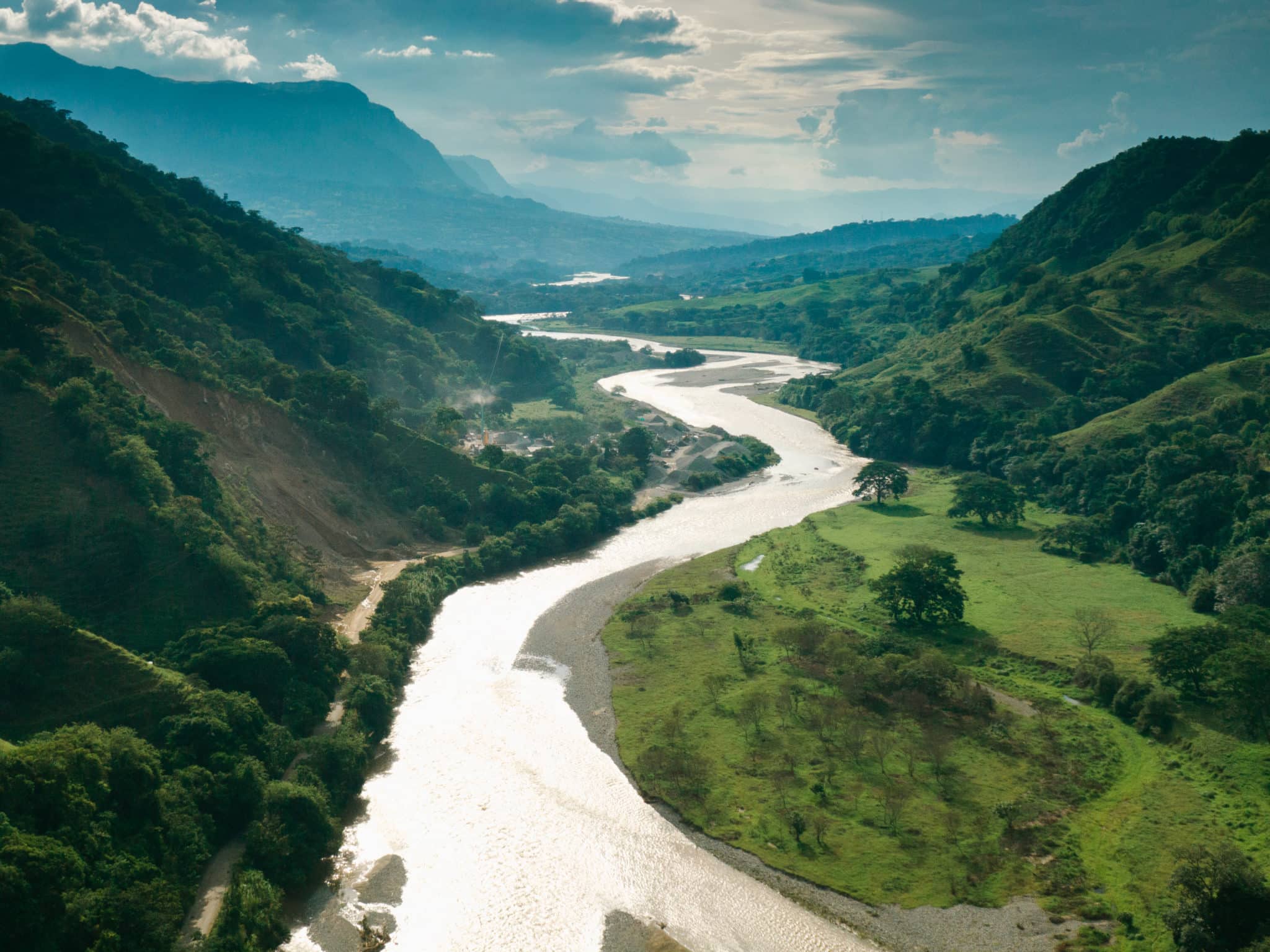 View over lush valley and hills and Rio Magdalena