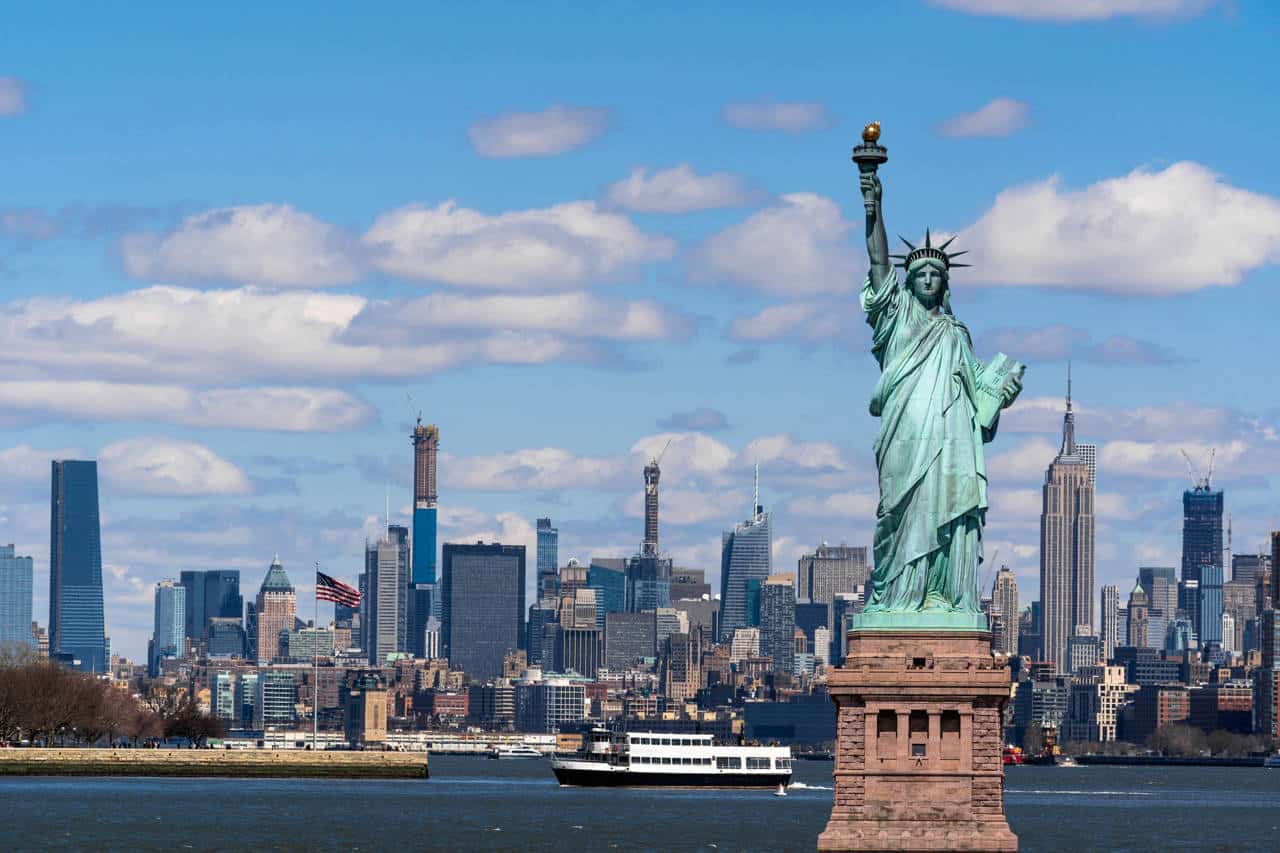 The Statue of Liberty over the Scene of New York cityscape river side which location is lower manhattan,Architecture and building with tourist concept