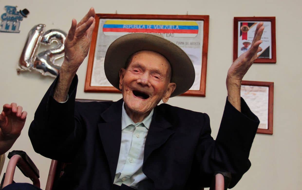 (FILES) 112-year-old Venezuelan farmer Juan Vicente Pérez gestures at his home in San Jose de Bolivar, Tachira state, Venezuela, on January 24, 2022. Juan Vicente Pérez Mora, certified in 2022 by Guinness World Records as the world's longest-lived man, died on April 2, 2024, at the age of 114, authorities and relatives confirmed. (Photo by Jhonny PARRA / AFP)