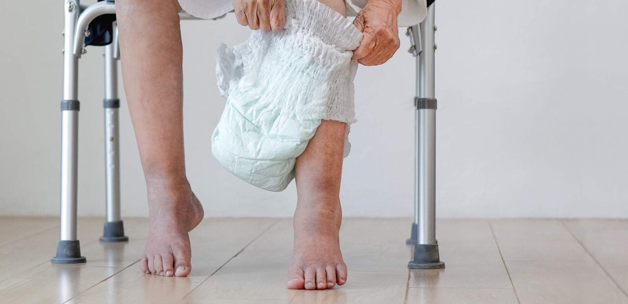 elderly woman changing diaper