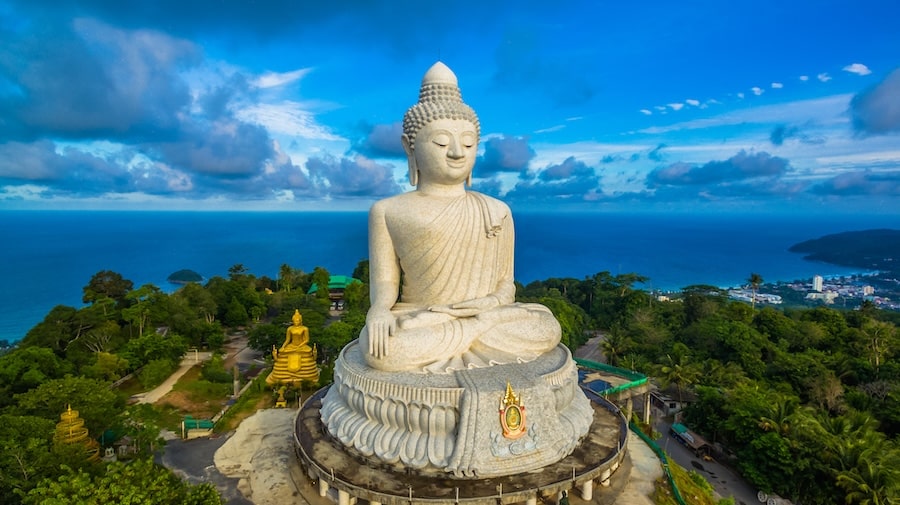 blue sky and blue ocean are on the back of Phuket Big Buddha statue.white Phuket big Buddha is the one of landmarks on Phuket island.