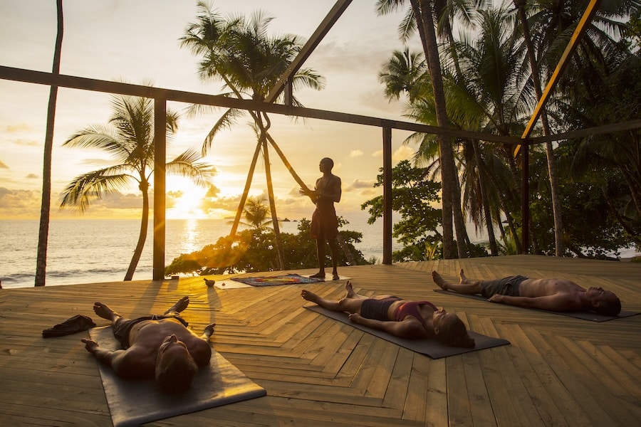 image SCP Corcovado Wilderness Lodge Sunset Yoga at the beach deck