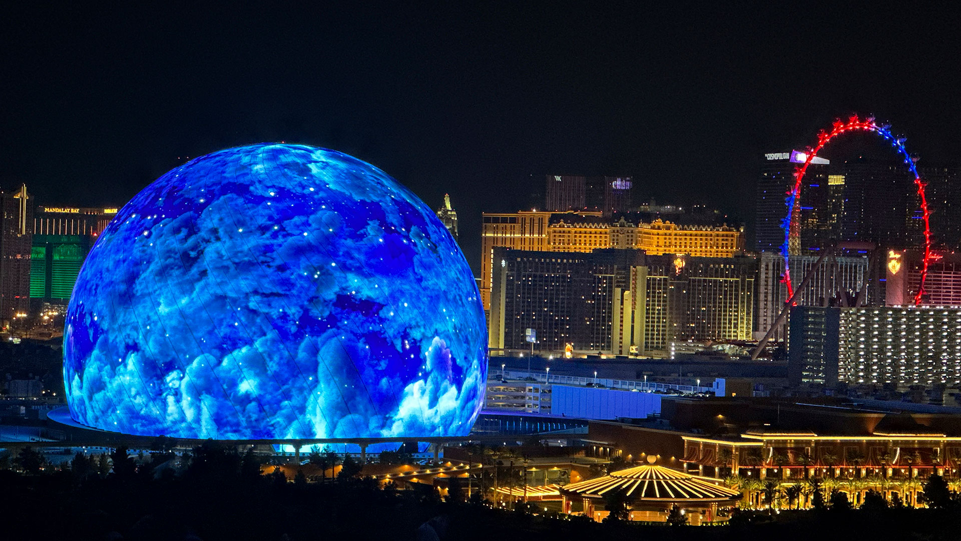 The MSG Sphere illuminates the Las Vegas skyline with a display to celebrate Independence Day as the Exosphere is fully lit up for the first time, as seen from the Metropolis, on Tuesday, July 4, 2023. (L.E. Baskow/Las Vegas Review-Journal)