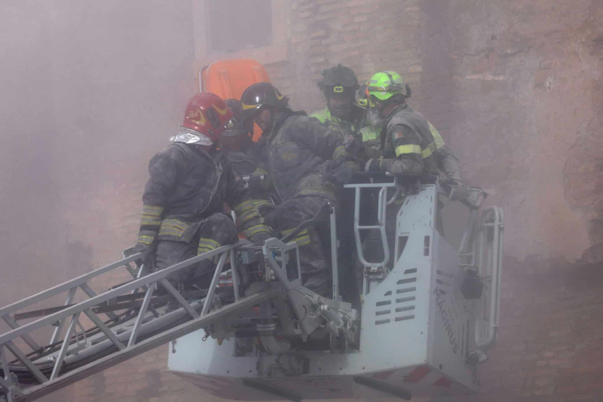 Dust rises following collapses of parts of the Torre dei Conti tower while members of emergency services work at the scene, near Via dei Fori Imperiali, near the Colosseum, in Rome, Italy, November 3, 2025. REUTERS/Remo Casilli