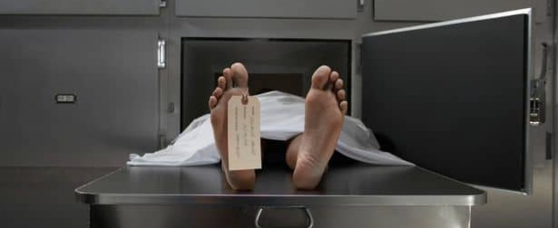 0_Cadaver-on-autopsy-table-label-tied-to-toe