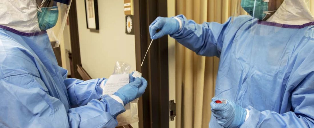 LITTLETON, Mass. – A medic with the Massachusetts National Guard takes a nasal swab that will be used to test for COVID-19 with a resident of the Life Care Center of Nashoba Valley, Littleton, Mass., April 3, 2020. The Massachusetts National Guard worked with the facility’s staff to administer COVID-19 tests to help prevent the spread of the virus. (Army National Guard Photo by Staff Sgt. Kenneth Tucceri)