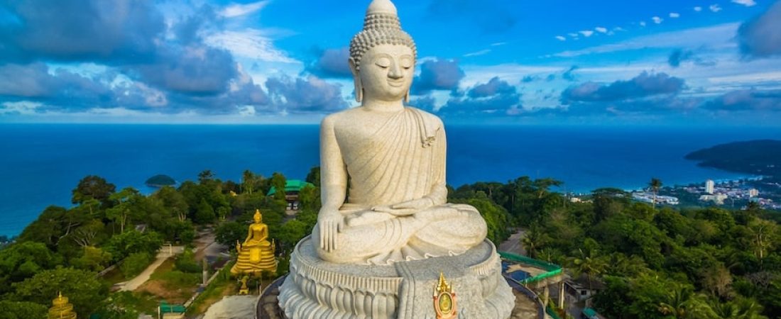 blue sky and blue ocean are on the back of Phuket Big Buddha statue.white Phuket big Buddha is the one of landmarks on Phuket island.