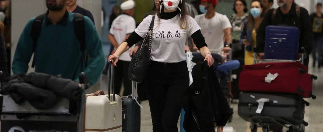 A traveller, wearing a mask as a precautionary measure to avoid contracting coronavirus, arrives on a flight from Europe at Guarulhos International Airport in Guarulhos, Sao Paulo state, Brazil, February 27, 2020. REUTERS/Amanda Perobelli