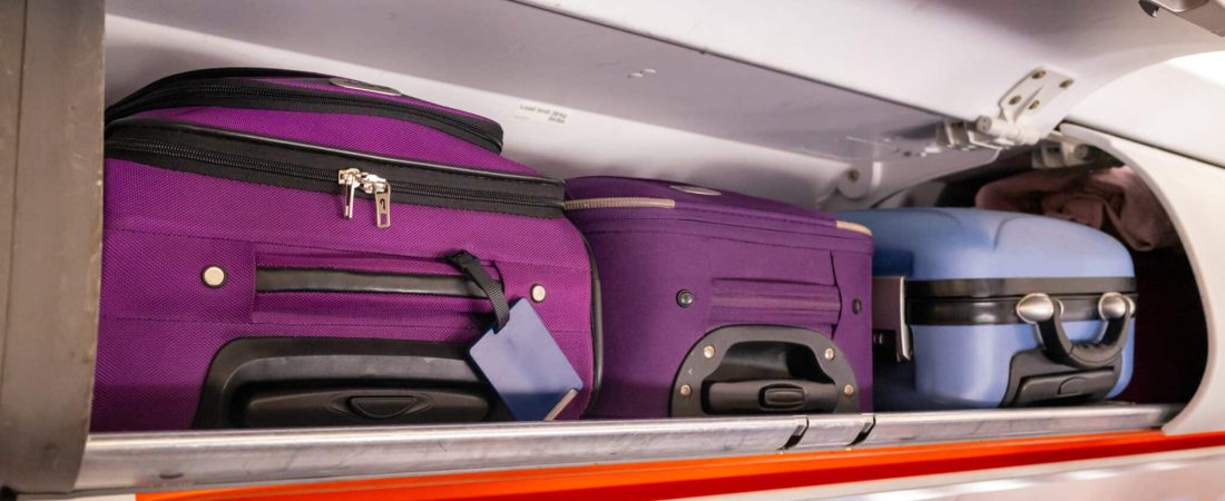 Hand luggage in the cabin overhead lockers of a passenger airplane, UK