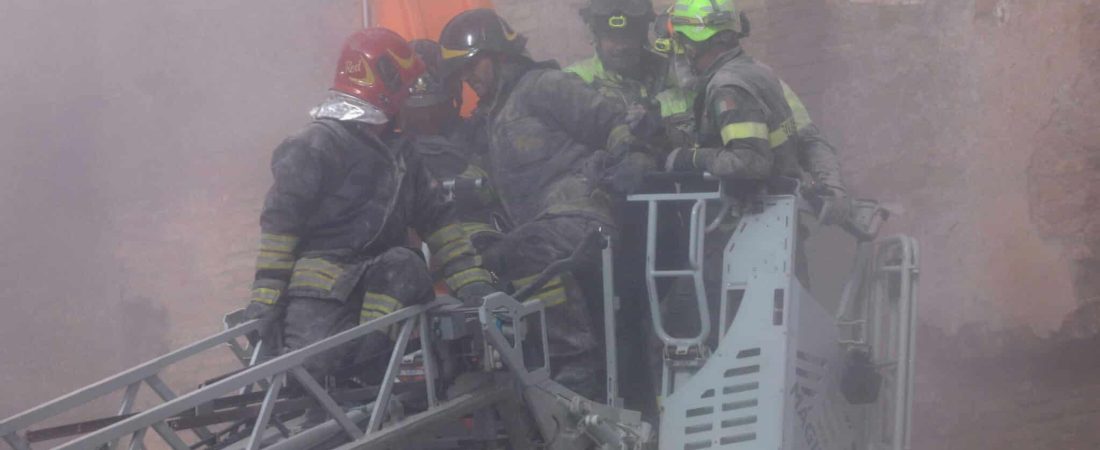 Dust rises following collapses of parts of the Torre dei Conti tower while members of emergency services work at the scene, near Via dei Fori Imperiali, near the Colosseum, in Rome, Italy, November 3, 2025. REUTERS/Remo Casilli