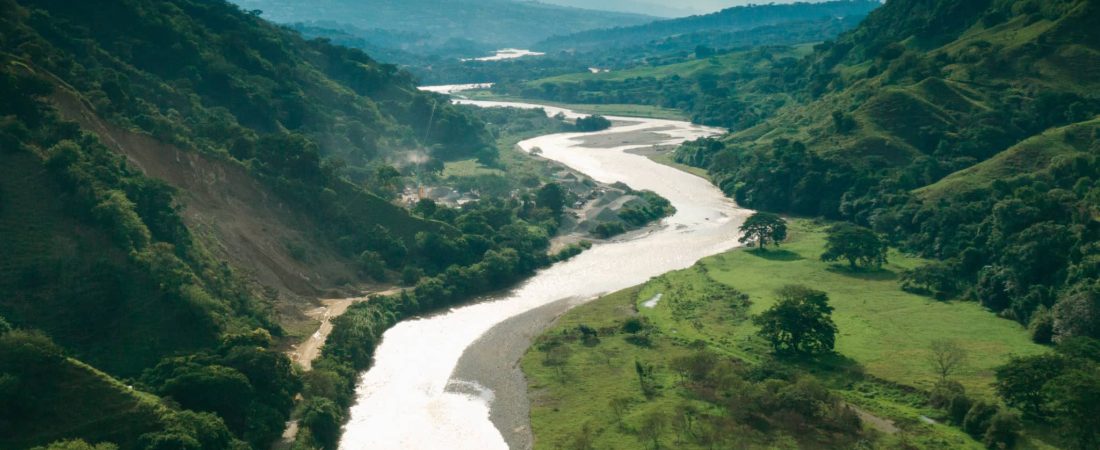 View over lush valley and hills and Rio Magdalena