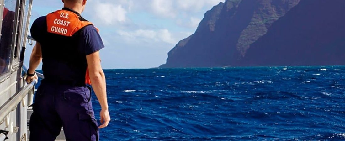 In this photo released by the U.S. Coast Guard, Coast Guard Cutter William Hart moves toward the Na Pali Coast on the Hawaiian island of Kauai on Friday, Dec. 27, 2019, the day after a tour helicopter disappeared with seven people aboard. Authorities say wreckage of the helicopter has been found in a mountainous area on the island. (Lt. j.g. Daniel Winter/U.S. Coast Guard via AP)
