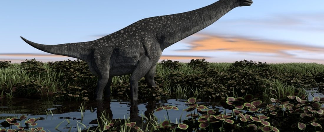 titanosaurus walking in swamp