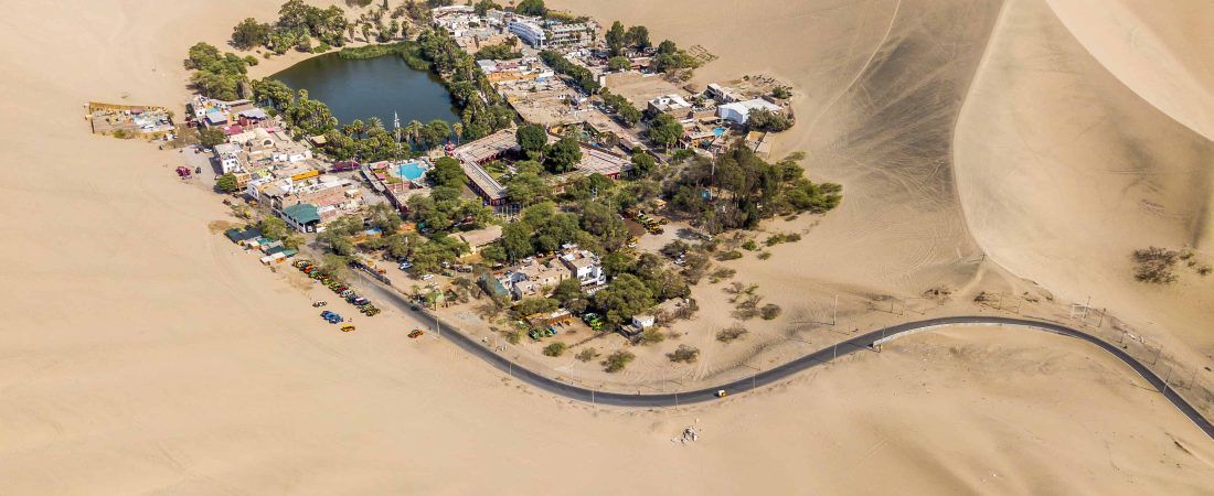 aerial photography of town in the middle of the desert